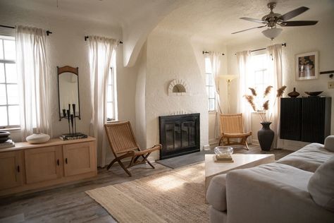 This cute white stucco house that was built in 1939 with really unique Spanish-style architectural features has been layered with calming neutrals to create a cozy and chic home. White Stucco House, Stucco House, Stucco Homes, Rental Apartment, Decorating Advice, Apartment Tour, Solid Wood Bed, Furniture Warehouse, Diy Curtains