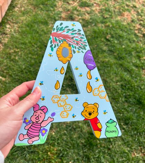 🍯✨ Custom wooden letters inspired by the beloved Winnie the Pooh! For @lauren_berends_regler 🐻🍯 Perfect for nurseries, kids’ rooms, or as a special gift. Swipe to see how each letter brings the Hundred Acre Wood to life! 🌳💛 Which character is your favorite? Let me know in the comments! 👇 #WinnieThePooh #CustomLetters #NurseryDecor #Handmade #createdbykatie #DisneyInspired Winnie The Pooh Diy Crafts, Wooden Letter Decoration Ideas, Winnie The Pooh Letters, Letter Painting Ideas, Letter Painting Ideas Wooden, Winnie The Pooh Diy, Letter Decoration Ideas, Letter Painting, The Hundred Acre Wood