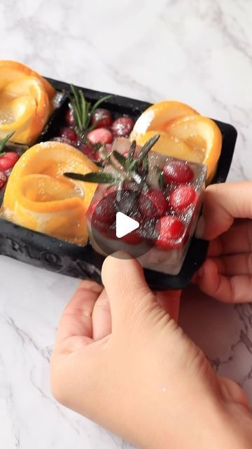 shelly bella on Instagram: "Festive ice cubes 🌲🍊such an easy way to elevate any cocktail or mocktail you make this season. I used orange slices, cranberries and rosemary sprigs with a little touch of @fancysprinkles edible glitter 🤍" Orange Cranberry Ice Cube Mimosas, Orange Juice Ice Cubes, Festive Ice Cubes, Cranberry Ice Cubes, Cranberry Ice, Creative Ice Cubes, Flavored Ice Cubes, Juice Ice Cubes, Rosemary Sprigs