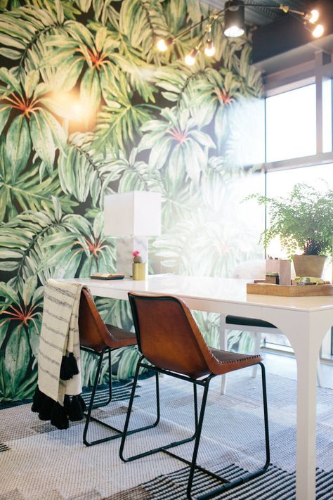 Oversized tropical palm leave printed wall paper: http://www.stylemepretty.com/living/2016/08/26/this-might-be-the-coolest-office-space-weve-ever-seen-no-it-is/ Photography: Love Ala - http://www.loveala.com/ Tropical Office, Pretty Office, Tropical Interior, Cool Office Space, Popular Interior Design, Palm Wallpaper, Estilo Tropical, Creative Office, Office Inspo