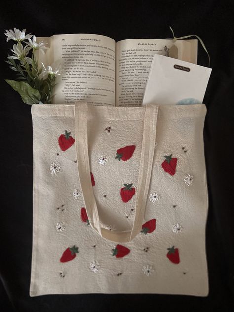 an off white 14” wide and 15.5 height tote bag with small embroidered red strawberries and white daisies Easy Tote Bag Design, Embroider Tote Bags, Hand Embroidery Tote Bag, Embroidery Tote Bag Design, Tote Bag Embroidery Ideas, Cottage Core Gifts, Embroidered Cottage, Hand Embroidered Tote Bag, Tote Bag Embroidery