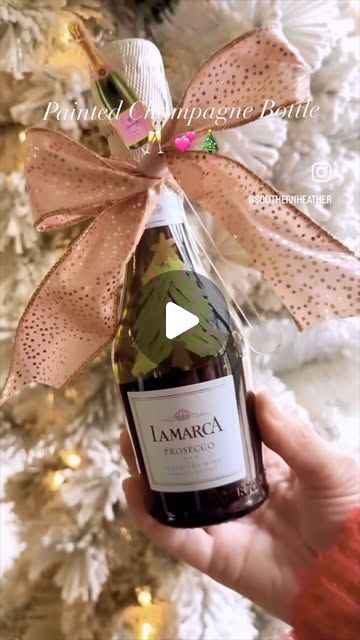 Heather on Instagram: "Painted Mini Champagne Bottles 
✨🍾✨🍾✨🍾✨🍾✨🍾✨

Make these for your neighbor, your tennis team, your hair stylist or anyone else on your nice list! ✔️ ✔️ ✔️ 
At $5 a bottle this is the 
🍾cutest, 
💕easiest and 
🎄festivest idea! 

HERE’S HOW:
🍾 Paint pens for the green tree and pink ornaments
🍾a gold metallic paint pen for the tree trunk 
🍾 I found these mini champagne bottles at Target - 3 pack for $15
🍾 add a pretty ribbon and cocktail stirrer or cocktail napkins
🍾 Tip: If you are hesitant to try this because you might mess up- nail polish remover will take it right off and you can try again! 💕" Decorated Champagne Bottles, Lamarca Prosecco, Pink Ornaments, Mini Champagne Bottles, Pretty Ribbon, Acrylic Ornaments, Pink Ornament, Tennis Team, Mini Champagne