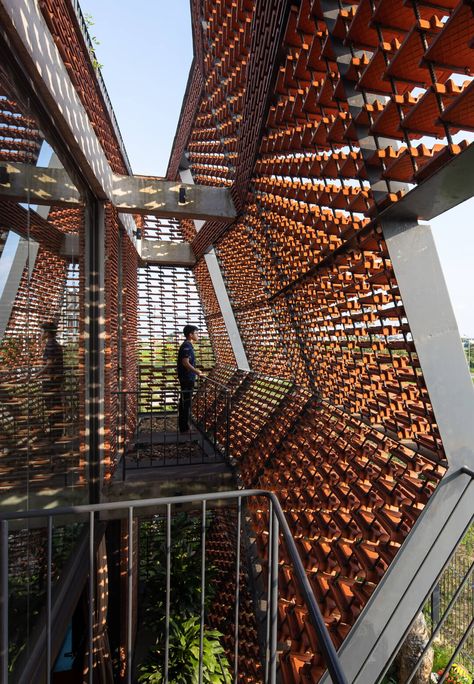 The Tile Nest house in Vietnam is a sculpturesque form in local clay tiles Detail Arsitektur, Shigeru Ban, Facade Architecture Design, Brick Architecture, Architecture Building Design, Architecture Concept Drawings, Brick Facade, Architecture Design Concept, Clay Tiles