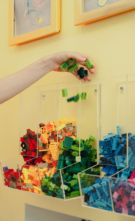 Easy access to a rainbow of LEGOs? Yes please! When we designed this secret Lego door with the hope that children of any age could easily grab their bricks and get to building! Lego Room Ideas Boys, Magnatile Storage Ideas, Kids Lego Display, Boys Lego Bedroom Ideas, Lego Moodboard, Lego Wall Diy, Kids Lego Room, Bug Bedroom, Lego Play Area