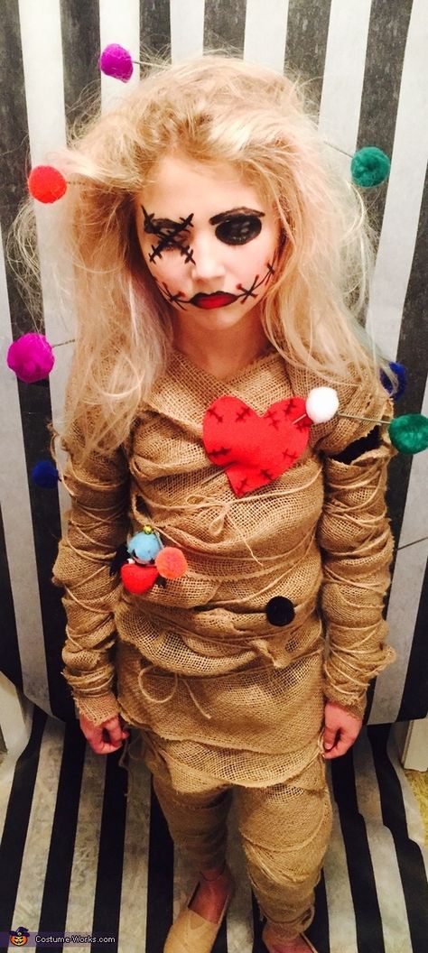 My daughter came up with the idea after last years halloween. She decided to be a voodoo doll. We used burlap, wooden dowels, Pom poms, hot glue gun, safety pins and twine to compete the look. We also used basic makeup; eyeliner, eyeshadow and lipstick. Photo 2 of 4. Halloween Makeup Videos, Diy Voodoo Doll Costume, Voodoo Doll Makeup, Voo Doo Doll, Diy Voodoo Dolls, Creepy Doll Costume, Voodoo Doll Costume, Voodoo Costume, Doll Makeup Halloween