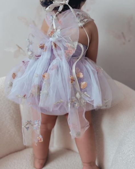 Arabella And Rose ™️ Est 2012 on Instagram: "Sugar Plum Fairy 💜🌸🧚🏻‍♀️ Sweet Eve in our sensational embroidered romper . We are obsessed with big bows 💜 @book.of.baby.eve" Fairy 1st Birthday Outfit, Fairy First Birthday Dress, Baby Fairy Dress, Fairy First Birthday Outfit, Baby Fairy Photoshoot, Fairy First Birthday Photo Shoot, Fairy Outfit Aesthetic, First Birthday Girl Outfit, Enchanted Birthday