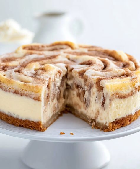 Cinnamon Roll Cheesecake Recipe - sandyrecipes.com Cheesecake Factory Cinnabon Recipe Copycat, No Bake Cinnamon Cheesecake, Cinnamon Cheesecake Bars, Cinnamon Roll Cheesecake Recipes, Croissant Cheesecake, Cinnamon Bun Cheesecake, Popular Cheesecake Recipes, Snickerdoodle Cheesecake, Roll Cheesecake