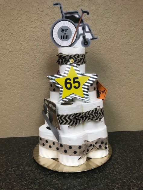 Toilet paper cake centerpiece Over The Hill Birthday Decorations, Men’s 60th Birthday Centerpieces, 60th Birthday Toilet Paper Cake, Toilet Paper Cake For 50th Birthday, Toilet Paper Cake, 65 Birthday, Cake Centerpieces, Party Centerpiece, Birthday Party Centerpieces