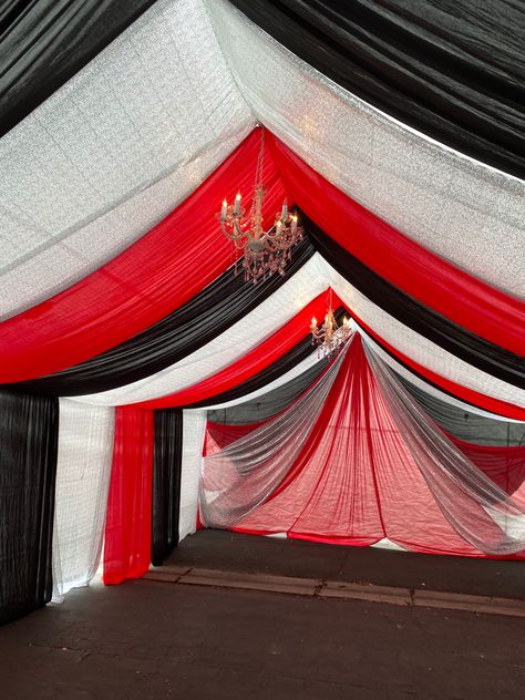 Elevate your event with our stunning draped tent decor. ✨ Create a magical atmosphere with #EventDecor #PartyPlanning #TentDraping #eventdecor #redandblack tent draping Red And Silver Decorations, Party Tent Decorations, Draped Tent, Tent Draping, Silver Decorations, Tent Decor, Ceiling Draping, Tent Decorations, Red Green Christmas