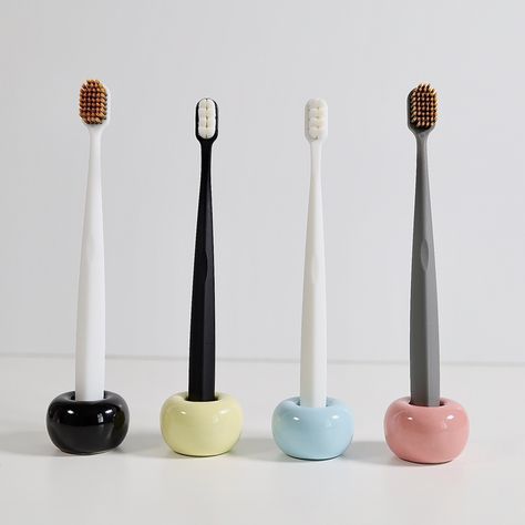 Creative ceramic toothbrush holder with simple but elegant design. Holds the manual (not electric) toothbrush to keep it clean and stylish Dimensions Overall: 1.6" diam (outer), 07" diam (inner), 1.1" h Weight: 2.7 oz Care Clean with water Fun Toothbrush Holder, Air Dry Clay Toothbrush Holder, Tooth Brush Holder Ideas, Toothbrush Aesthetic, Toothbrush Holder Ceramic, Pottery Toothbrush Holder, Toothbrush Design, Ceramic Toothbrush Holder, Electric Toothbrush Holder