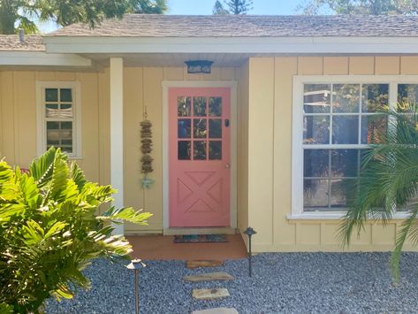 Pink And Yellow House Exterior, Yellow House Pink Door, Yellow House Pink Front Door, Yellow Beach House Exterior, Pale Yellow House Exterior, Light Yellow House, Yellow Beach House, Tropical Exterior, Doors Colors