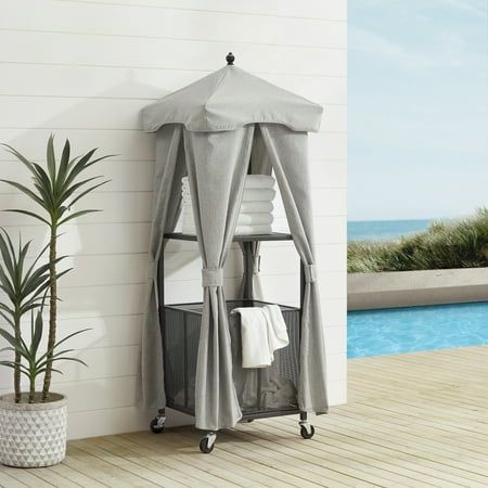 The Homestock Towel Valet offers mobile poolside organization. Featuring a powder-coated steel frame and sturdy caster wheels, the towel caddy can move wherever it's needed. The open shelf keeps dry towels close at hand, while the bin beneath is a perfect hamper for wet towels, keeping your deck free of clutter. A polyester cover protects your towels from changes in weather or a rogue splash, making the Homestock Towel Valet a must-have for the swimming season. Beach Towel Storage, Pool Toy Storage, Pool Storage, Steel Deck, Black Towels, Caster Wheels, Towel Storage, Patio Accessories, Modern Patio