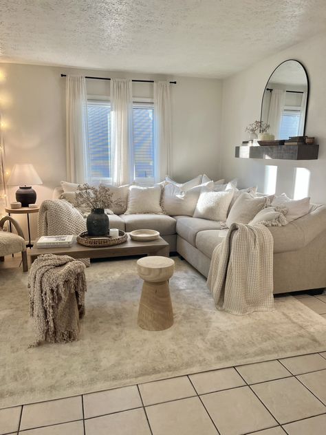 Beige, Cream, White, Living Room Decorating. Neutral Concept for Small Living Room Breaking rules: over the sofa mantel and too many pillows, no color. Over the couch shelf . Awkward small sectional decorating Cream Colored Sofa Decor, Neutral Living Room Corner Sofa, Neutral Aesthetic Home Decor Living Room, Cream Couch Decorative Pillows, Comfy Cream Couch, Neutral Corner Sofa, Small Cream Living Room, Cream Sofa Styling, Living Room Designs Cream Couch