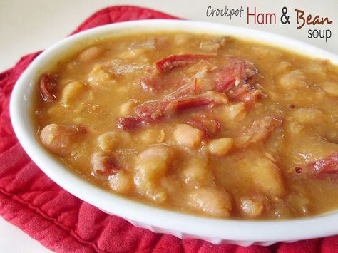 Crockpot Ham & Bean Soup--- one of my absolute favorites! There's nothing like curling up in your favorite chair with a comforting bowl of ham and bean soup on a chilly night. :) Ham And Northern Bean Soup, Northern Bean Soup, Dumplings Crockpot, Crockpot Ham And Beans, Ham Bean Soup, Soup With Dumplings, Ham And Bean, Crockpot Ham, Slow Cooker Ham