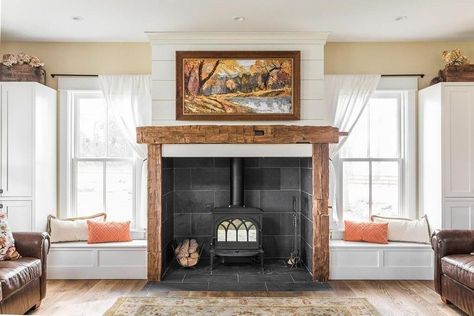 Wood-burning fireplace with windowseats on either side via A Modern Farmhouse For Sale in Indiana Wood Stove Surround, Wood Burning Stoves Living Room, Living Room Mantel, Modern Rustic Farmhouse, Wood Stove Fireplace, French Country Living Room, Farmhouse Fireplace, Rustic Fireplaces, Trendy Living Rooms