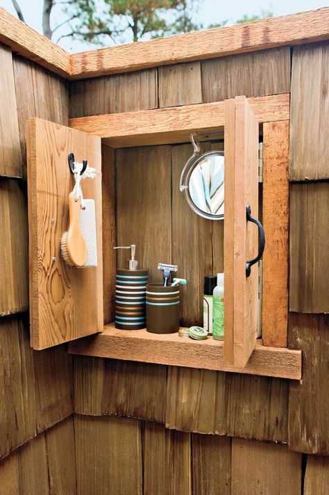 A wooden outdoor medicine cabinet is great to hold all your shower must-haves. Outdoor Shower Ideas, Outside Showers, Outdoor Shower Enclosure, Outdoor Shower Diy, Ultimate Backyard, Outdoor Bathroom Design, Garden Shower, Outdoor Bath, Diy Shower