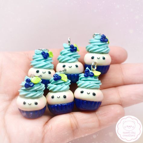 Blueberry Kawaii cupcake charms 🫐🧁#blueberry #blueberrycupcakes #minicupcakes #kawaii #kawaiicupcakes #kawaiijewelry #kawaiiaccessories #handmade #handmadejewelry #handmadecharms #polymerclay #pilymerclayjewelry #polymerclaycharms #minifood #miniaturefood #miniaturefoodjewelry #clay #clayjewelry #sweetclaycreations #cute #onlineshopping #giftideas Clay Shelf, Craft Miniature, Blueberry Cupcake, Kawaii Cups, Charm Ideas, Blueberry Cupcakes, Gingerbread Decor, Random Products, Mini Clay