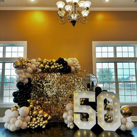 Half a century, and still shining bright! ✨ For this special 50th birthday, we created a dazzling setup with a gold shimmer wall, elegant black, gold, and beige balloons, and a striking ‘50’ marquee. The entrance sign added the perfect touch to welcome guests to an evening of celebration and joy. Here’s to celebrating life’s golden moments in style! 🎈🎉 #50thBirthday #SculptedAir #LuxuryBalloonDecor #HoustonEvents #MilestoneCelebration #GoldenYears Black And Gold Balloon Wall, Gold Shimmer Wall, Beige Balloons, Black And Gold Balloons, 50th Birthday Decorations, Golden Moments, Shimmer Wall, 50 & Fabulous, 50 And Fabulous