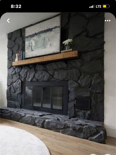 Black Stone Corner Fireplace, Over Grouted Stone Fireplace Before And After, Dark Wash Fireplace, Painting Rock Wall Fireplace, Black Rock Wall Fireplace, Grey Painted Rock Fireplace, Rock Chimney Makeover, Black Stone Fireplace Modern, Rock Fireplace Painted Black