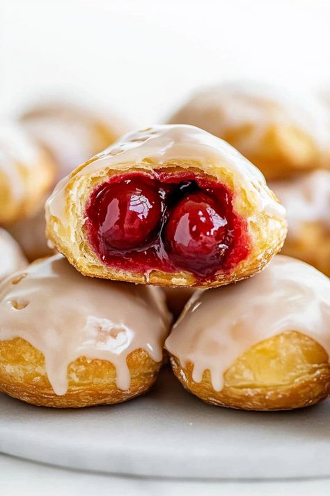 These bite-sized cherry pie bombs are delightful, handheld treats that come together in about 20 minutes with just four key ingredients. Easy Mini Pie Recipes, Cherry Pie Bites, Bite Sized Desserts, Mini Cherry Pies, Cherry Hand Pies, Pie Bites, Cherry Filling, Cherry Desserts, Boston Cream Pie