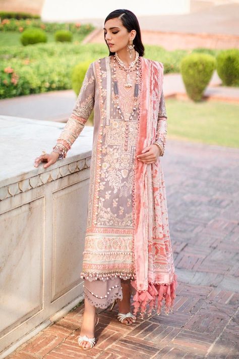 Whatsapp at +919891891842 100% Original Guaranteed Unstitched Dress Material  Beauty revealed through jewels and its secrets on a beige velvet shirt with floral embroidery in contrasting colors of gold, pink and khaki green. This enchanting fall ensemble is completed with a pink Pollachi shawl and beige pants. Component Details Measurements Dyed And Embroidered Center Panel On Velvet 0.35 Meter Dyed And Embroidered Side Kali (L+R)On ... Pakistani Winter Dresses, Pakistani Boutique, Pakistani Suits Online, Unstitched Dress Material, Luxury Winter, Velvet Suit, Sana Safinaz, Beige Pants, Velvet Shirt