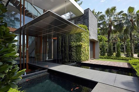 Bridge above the koi pond creates a mesmerizing entrance Koi Pond House Entrance, Villa Entrance, Holiday In Singapore, Extraordinary Homes, Contemporary Houses, Koi Ponds, Pond Ideas, Rancho Mirage, Luxury Pools