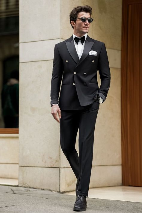 Our Black Tuxedo, crafted with meticulous attention to detail, this ensemble boasts a double-breasted jacket adorned with sleek satin lapels and subtle, modern touches. Paired with impeccably tailored trousers. Whether you're commanding the boardroom or stealing the show at a high-profile event, this tuxedo ensures you exude confidence.  #singlebreasted #suit #suits #slimfit #menstyle #menfashion #fashioninspo #formalwear #menclothing #formalattire #tuxedo #tuxedos #blacktuxedo Black Tuxedo Suit For Men, Double Breasted Tuxedo Suit, Mens Tuxedo Styles, Double Breasted Suit Wedding, Groom And Best Man Suits, Double Breasted Suit Men Wedding, Suit Coat For Men, Men's Tuxedo Styles, Double Breasted Suit Men