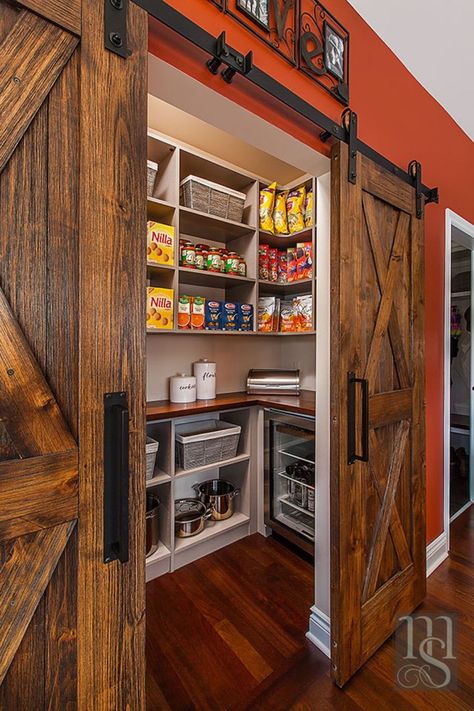 By utilizing the closet space in the adjoining home office, we were able to create a walk-in pantry accessed through the nook. Rustica weathered barn doors hide the large walk-in pantry housing more Subzero wine and beverage refrigeration. Log Cabin Pantry, Walk In Pantry With Barn Door, Log Cabin Walk In Closet, Pantry With Island Walk In, Country Pantry Ideas, Western Pantry Ideas, Barndominium Pantry Ideas, Large Pantry Ideas Walk In, Rustic Walk In Pantry