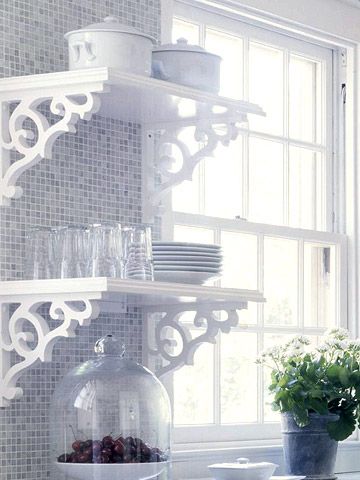 Open shelves replace upper cabinetry in this century-old kitchen, giving it an airy, clean feeling. While the shelves answer the call for simplicity, their lacy scrollwork brackets nod to an era that favored ornamentation. Lighting strips under the lower shelves provide helpful task lighting for the countertops Muebles Shabby Chic, Open Kitchen Shelves, Kitchen Shelf, Chic Kitchen, Open Shelves, Open Kitchen, Kitchen Shelves, A Shelf, Shelf Decor