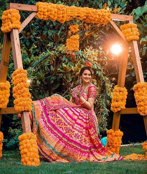 9 Awesome Mehendi Party Ideas For That Extra Element Of Fun! #mehendi #mehendidesigns #mehendiceremony #mehendiparty #partyideas #weddingparty #indianrituals #indianwedding Marigold Flower Garland, शादी की तस्वीरें, Mehendi Decor Ideas, Mehendi Ceremony, Bridal Photography Poses, Desi Wedding Decor, Mehndi Decor, Bride Photoshoot, Indian Wedding Photography Poses