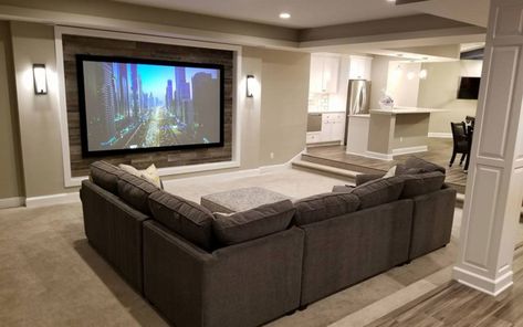 5 Fixed - Screen Innovations Family Room With Projector Screen, Basement With Projector, Basement Projector Wall Ideas, Projector Wall Ideas, Projector Screen Living Room, Craftsman Family Room, Basement Entertainment Center, Projector Screen Ideas, Dark Brown Sofa