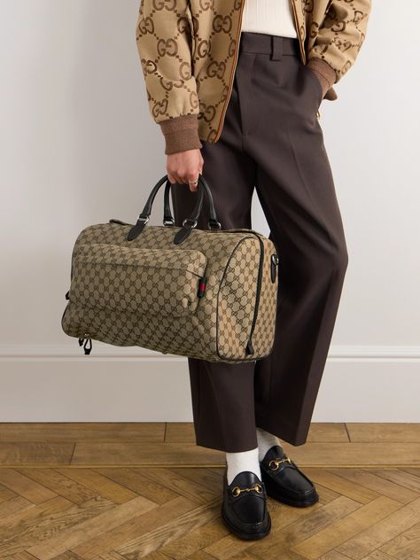 Few styles can live up to the status of an investment piece quite the way Gucci's duffle bag will. It's been crafted in Italy from hardwearing coated-canvas mapped with the house's distinctive 'GG' monogram and is finished with supple leather accents, including sturdy top handles. Internal and external organisation keeps travel essentials neatly grouped. Duffle Bag For Men, Gucci Travel Bag, Cow Tops, Gucci Collection, Canvas Duffle Bag, Gg Monogram, Summer Sunglasses, Gucci Leather, Leather Accents