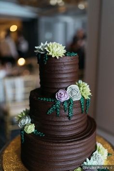 Wedding cake ideas - chocolate greenery icing flowers three tier {Life Like Ruby's}  Wedding cake ideas - chocolate greenery icing flowers three tier {Life Like Ruby's} Chocolate Frosted Wedding Cake, Chocolate Icing Wedding Cake, Chocolate Ganache Wedding Cake, Nature Wedding Cake, 17th Cake, Wedding Cake Nature, Ruby Wedding Cake, Wedding Cake Chocolate, Chocolate Wedding Cakes