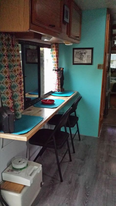 Change out dinette. This saves a lot of space and has multiple uses: eating surface, buffet, desk, prep, etc. Camper Table Ideas, Rv Desk Ideas, Rv Table Ideas, Camper Office, Camper Revamp, Rv Camper Interior, Rv Table, Camper Renovations, Rv Decorating