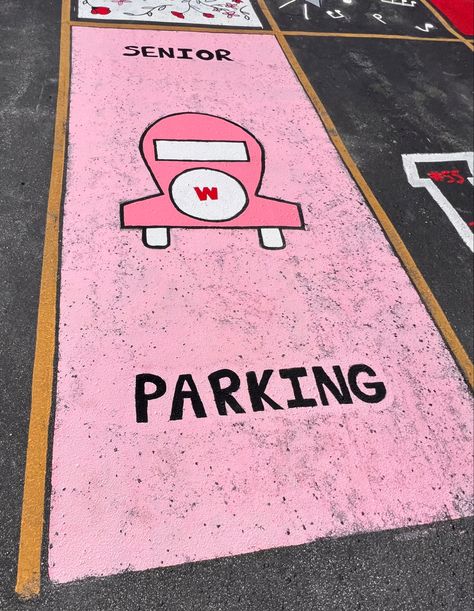 Parking spot with light pink background, and pink monopoly free parking car. Say Senior on top and parking on bottom. Monopoly Parking Spot Painting, Monopoly Senior Parking Spot, Senior Parking Spaces Funny, Senior Spots, Parking Lot Painting, Senior Board, High School Plan, Senior Year Fun, Senior Parking Spot