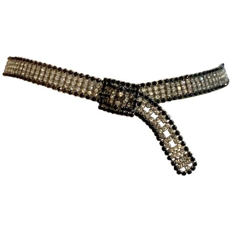 Amazing vintage metal belt (estimated circa 1970s) featuring clear/white rhinestones with a black rhinestone border set in silver tone metal. Buckle closure. Perfect for making a plain evening gown a little more special! Closure can be adjusted for belt to fit approximately 27" to 30 1/2" waist. Excellent condition with no flaws to note. 1970s Black And White, Aesthetic Accessories, Emo Aesthetic, 2000 Fashion, Chain Belts, Gold Belts, Rhinestone Belt, Black Tweed, Vintage Belt