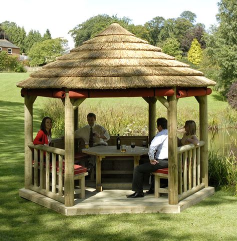 Gazebos are also quite popular in parks and backyards. They can transform the look of your backyard with a relatively small investment. Once you enjoy your first dinner outdoors in the comfort of your own patio, you will be glad that you made this decision! The main difference between gazebos and pergolas is that gazebos ALWAYS have a round shape. This is a quick and easy trick to tell them apart! Round Gazebo, Country Cottage House Plans, Garden Huts, Canopy Ideas, Diy Gazebo, Bamboo House Design, Retractable Pergola, Wooden Gazebo, Garden Pavilion