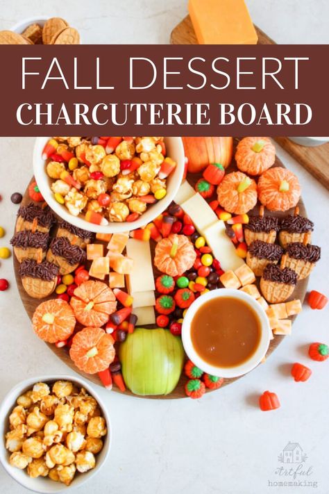 a fall dessert charcuterie board with apple slices, caramel corn, and edible pumpkins and acorns Fall Kids Charcuterie Board, Orange Charcuterie Board Ideas, Orange Charcuterie Board, Fall Dessert Charcuterie, Edible Acorns, Nutter Butter Acorns, Fall Themed Desserts, Dessert Charcuterie Board, Dessert Charcuterie