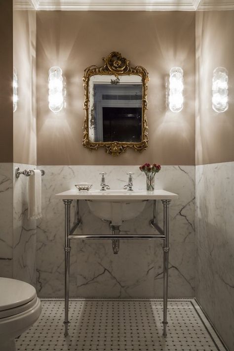 Great powder room  Always an elegant look to have marble going up to chair rail height.  Saves $ from doing a whole wall and you get to add color! Guest Bathroom Half Wall, Elegant Toilet Room, Half Tile Powder Room, Retro Marble Bathroom, Powder Room Tile Floors, Marble Powder Bathroom, Parisian Hotel Bathroom, Marble Half Wall Bathroom, Half Height Tiles Bathroom