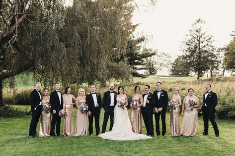 bridal party portrait outdoors, groomsmen in black tuxes, bridesmaids in rose gold dresses Rose Gold Dresses, Groomsmen In Black, Rose Gold Shirt, Real New York, Loose Bouquet, Purple Color Palette, Wedding Goodies, Party Portrait, Gold Dresses