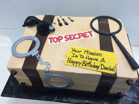 Detective top secret shaped briefcase themed cake, with fondant handcuffs, glasses, and magnifying glass Spy Cake, Escape Room Themes, Secret Agent Party, Spy Birthday Parties, Detective Party, Detective Theme, 12th Birthday Cake, Clue Party, Mystery Parties