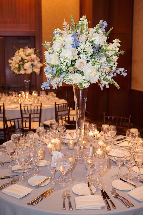 Dusty Blue And White Wedding Decor, Blue And White Flower Arrangements Centerpieces, Elegant Blue Wedding Theme, White And Blue Centerpieces Wedding, White And Blue Wedding Centerpieces, Wedding Flowers For Tables, Tall Wedding Centerpieces Elegant, Blue And White Wedding Centerpieces, Blue And White Centerpieces