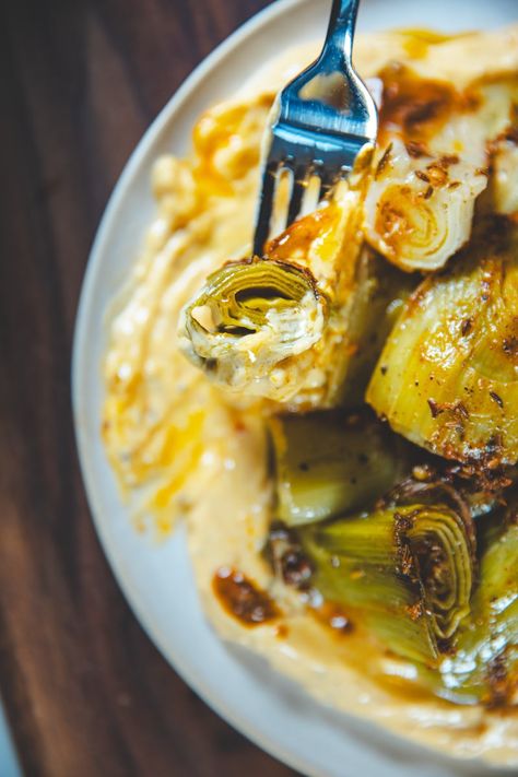 This perfect plate is formed of braised leeks, lime pickle yoghurt and spiced tempering butter. It's a beautiful thing to eat. Leeks Recipes, Sustainable Recipes, Starchy Sides, Braised Leeks, Vegetarian Quiche, Leek Recipes, Lime Pickles, Eat Happy, Happy Belly