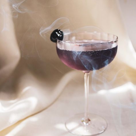 A smokey mezcal riff on a classic Aviation cocktail. Smokey Cocktails, Purple Whiskey Cocktail, Blackberry Mezcal Cocktails, Smoked Mezcal Cocktail, Purple Rain Cocktail, Mezcal Craft Cocktail, Mezcal Margarita, Aviation Cocktail, Fire In The Sky