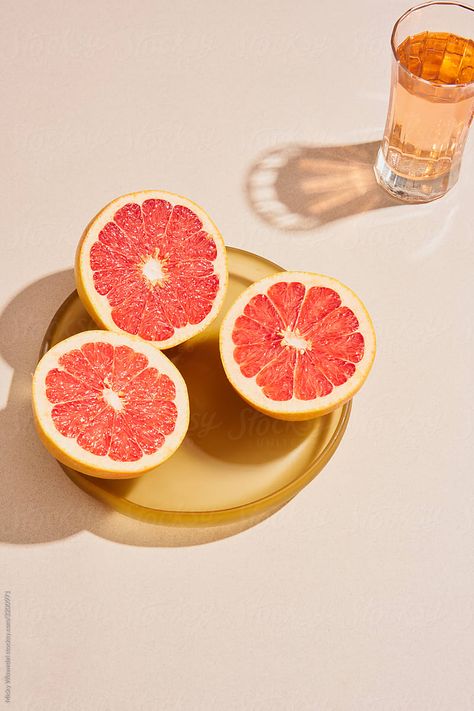 Bright vibrant summery grapefruit or pomelo on a serving dish with a glass of cordial Pomelo Photography, Grapefruit Photography, Fruits Photography, Spring Moodboard, Still Life Pictures, Collagen Drink, Still Life Fruit, Fruit Photography, Private Chef