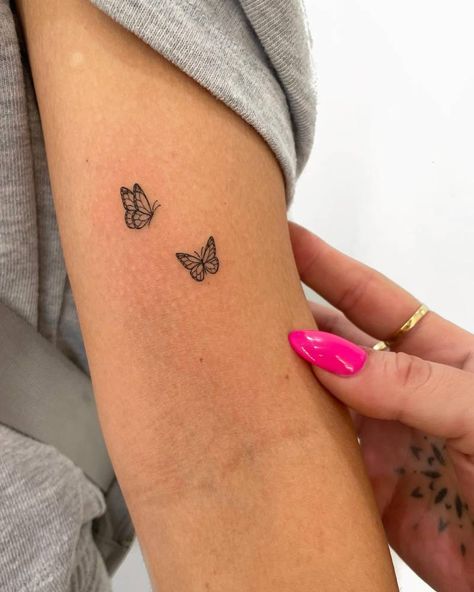 Butterfly couple tattoo located on the bicep, fine line Beautiful Butterfly Tattoos For Women, Small Butterflies Tattoo, White Butterfly Tattoo, Butterfly Tattoos On Arm, Tato Minimal, Basic Tattoos, Small Girly Tattoos, Small Forearm Tattoos, Butterfly Tattoos For Women