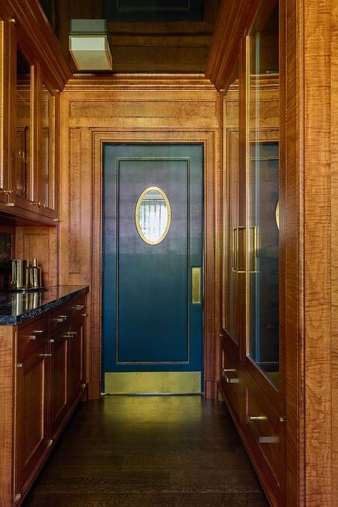 Wooden pantry features a blue leather and brass nailhead swinging door. Mid Century Modern Butlers Pantry, Butler Door Swinging, Swinging Pantry Door, Pantry Door Design, Pantry Features, Beadboard Trim, Gray Shaker Cabinets, Wooden Pantry, Metal Bins