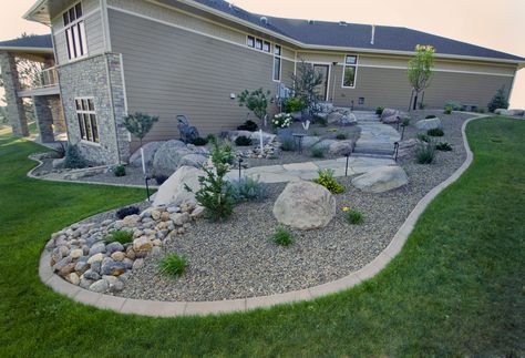 Pea Gravel Landscaping Around House, River Rock And Pea Gravel Landscaping, White House Landscaping, Pea Gravel Landscaping, Retaining Wall Landscape, Rockery Ideas, Rc Crawler Course, Hillside Terrace, Xeriscape Front Yard