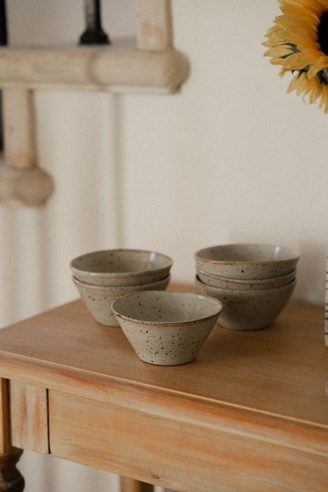 These bowls are your reliable companion, whether it's morning granola, a hearty serving from the stove, or a late-night snack. Designed for convenience, they stack effortlessly and store neatly. Made from durable stoneware and adorned with a lustrous white glaze, each saucer is meticulously handcrafted on the potter's wheel, ensuring a unique touch to every piece. Each bowl is organically shaped and one of a kind. All items are dishwasher safe, but highly recommend handwashing with care to preserve their craftsmanship. Since each piece is individually crafted on the wheel, expect slight variations in size, shape, or color between the products and the images displayed. Bowl Ceramic Design, Minimalist Breakfast, Wheel Ceramics, Pottery Photography, Ceramic Minimalist, Pottery Unique, Ceramics Pottery Bowls, Pottery Inspo, Unique Plates