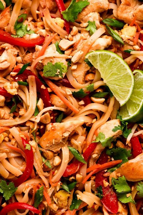 Chicken Pad Thai is a flavorful noodle stir-fry full of vegetables, chicken, rice noodles, eggs, and peanuts in a sweet and savory sauce. Make this popular dish at home in just 30 minutes! #thaifood #stirfry #asianrecipe | GarnishandGlaze.com Rice Noodle Chicken Stir Fry, Spicy Chicken Pad Thai, Pork Pad Thai, Chicken Rice Noodles, Coconut Curry Shrimp, Vegetable Lo Mein, Peanut Curry, Chicken Pad Thai, Sweet And Spicy Chicken